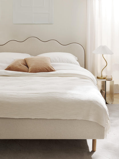 Romelis Upholstered Bed with Wavy Headboard
